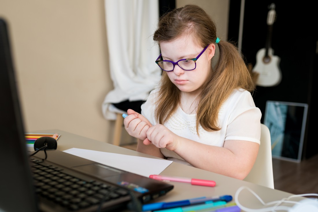  Disability Support For Children, Adults and Seniors - Calgary, AB | ComForCare - teenager-girl-with-down-syndrome-learning-online-a-2023-11-27-05-13-20-utc